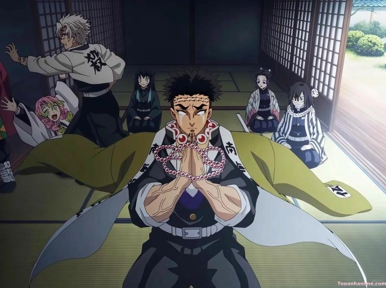 Gyomei mặc áo haori màu nâu với hoa văn Nam mô a di đà phật